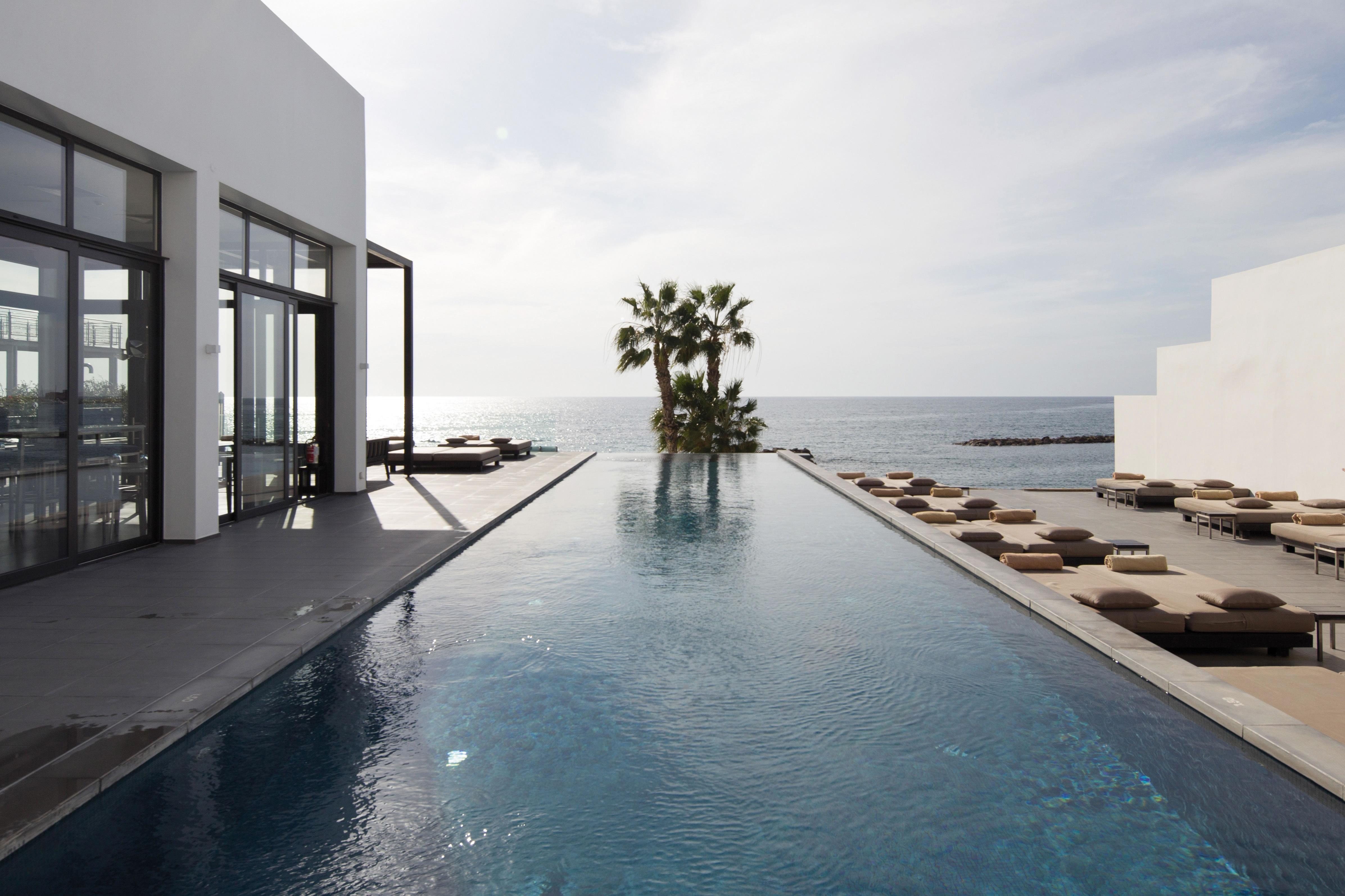 Almyra Hotel Paphos Luaran gambar The pool at the Hotel