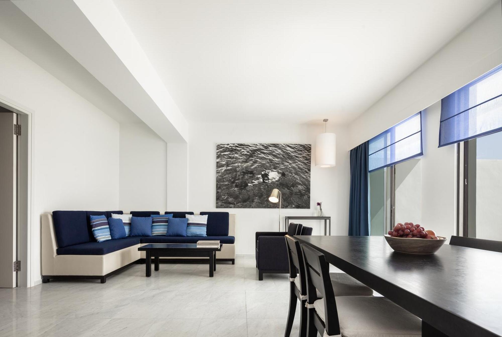 Almyra Hotel Paphos Luaran gambar A living room in a suite at the hotel