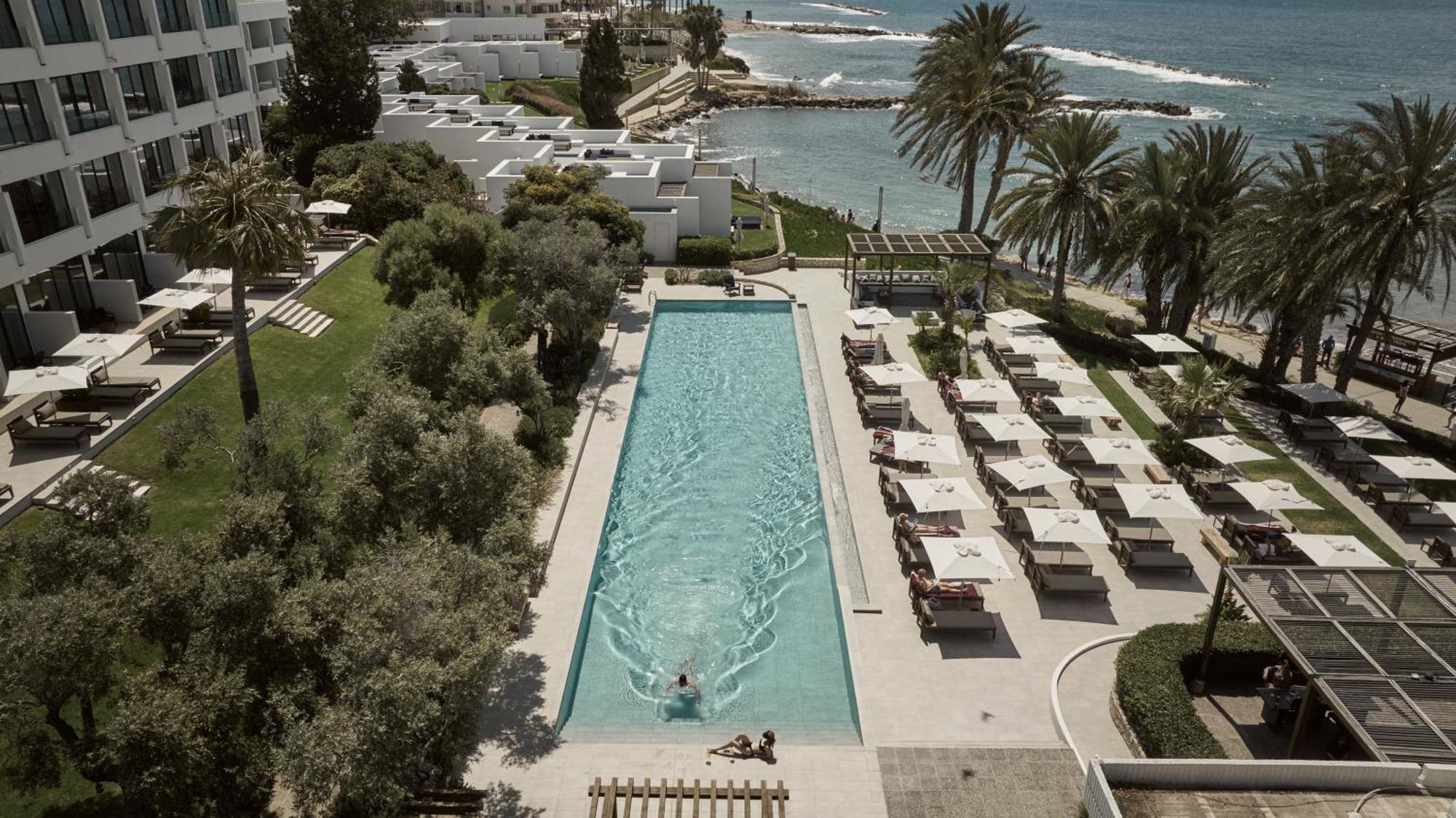 Almyra Hotel Paphos Luaran gambar The pool at the Royal